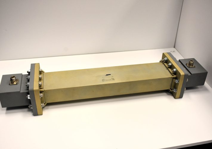 A resonant waveguide cavity which resonates at frequencies corresponding to half wavelength intervals of the cavity length